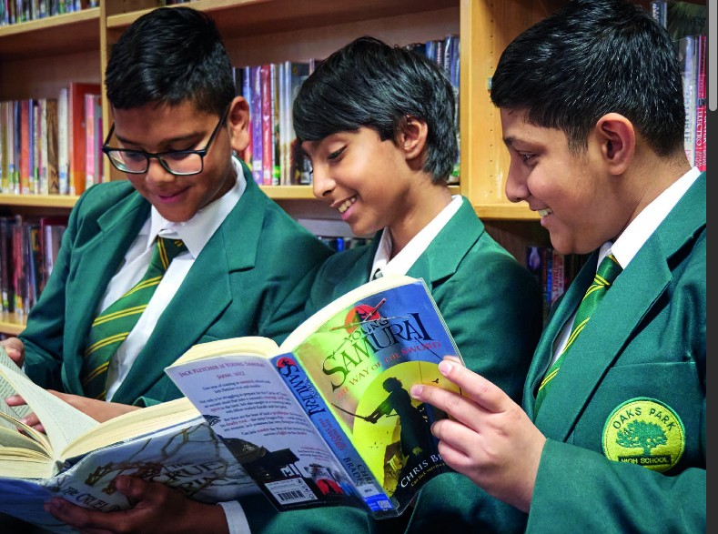 Oaks Park students reading together in the school library